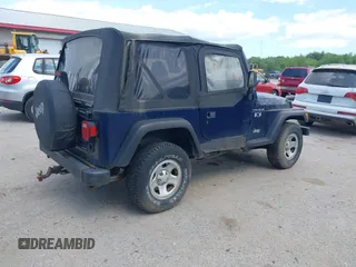 2002 Jeep Wrangler X z VIN 1J4FA39S82P735794, wystawiony jako IAAI lot #42411386 z przebiegiem 141 219 mil mil oraz . Historia ofert i sprzedaży dostępna na DreamBid. Obrazek 4.