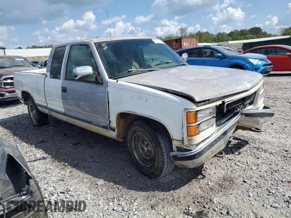1994 GMC Sierra 1500 with VIN 1GTEC19KXRE557960, listed as a Copart auction lot 71677974 with 194,641 mi miles and Salvage Title. Bid and sale history available at DreamBid. Image 4.