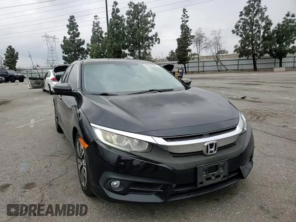 2016 Honda Civic EX-T z VIN 2HGFC1F33GH634029, wystawiony jako Copart lot #56026045 z przebiegiem 168 676 mil mil oraz Szkoda całkowita • Salvage title. Historia ofert i sprzedaży dostępna na DreamBid. Obrazek 13.