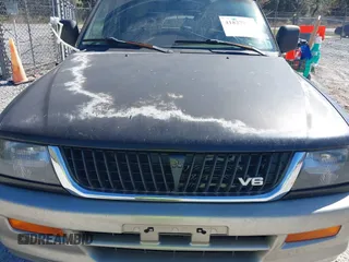 1999 Mitsubishi Montero Sport LS with VIN JA4LS31H7XP018312, listed as a IAAI auction lot 41827943 with 204,814 mi miles. Bid and sale history available at carsss.com. Image 6.