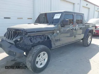 2020 Jeep Gladiator Sport S z VIN 1C6HJTAG7LL154664, wystawiony jako IAAI lot #42033131 z przebiegiem 73 282 mil mil oraz . Historia ofert i sprzedaży dostępna na DreamBid. Obrazek 2.