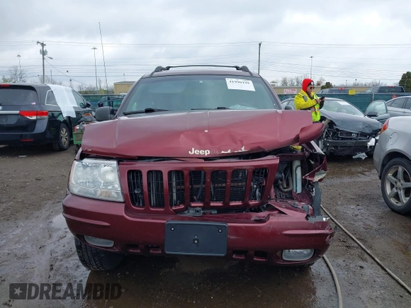 1999 Jeep Grand Cherokee Limited with VIN 1J4GW68N5XC642670, listed as a IAAI auction lot 41990199 with 154,492 mi miles. Bid and sale history available at carsss.com. Image 13.