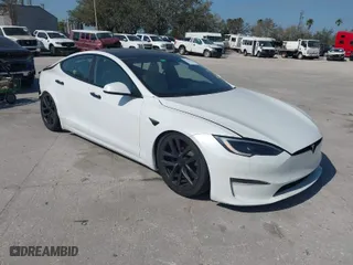 2022 Tesla Model S Plaid with VIN 5YJSA1E64NF484904, listed as a IAAI auction lot 41594464 with 25,299 mi miles. Bid and sale history available at carsss.com. Image 1.