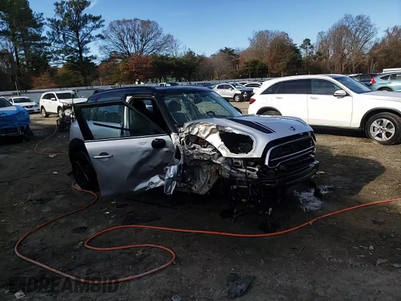 2016 MINI Countryman S with VIN WMWZC5C55GWU22112, listed as a Copart auction lot 82132654 with 60,210 mi miles and Salvage Title. Bid and sale history available at DreamBid. Image 13.
