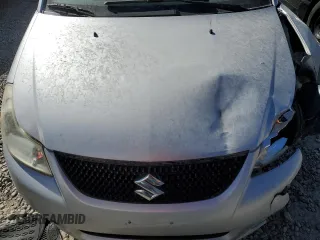 2013 Suzuki SX4 LE with VIN JS2YC5A31D6100472, listed as a Copart auction lot 73356934 with Not Provided miles and Salvage Title. Bid and sale history available at DreamBid. Image 12.