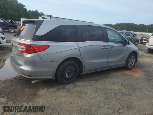 2018 Honda Odyssey EX-L with VIN 5FNRL6H74JB099282, listed as a Copart auction lot 55031025 with 137,359 mi miles and Salvage Title. Bid and sale history available at DreamBid. Image 3.