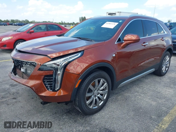 2019 Cadillac XT4 FWD Premium Luxury z VIN 1GYFZCR41KF183507, wystawiony jako IAAI lot #41987176 z przebiegiem 64 803 mil mil oraz . Historia ofert i sprzedaży dostępna na DreamBid. Obrazek 2.