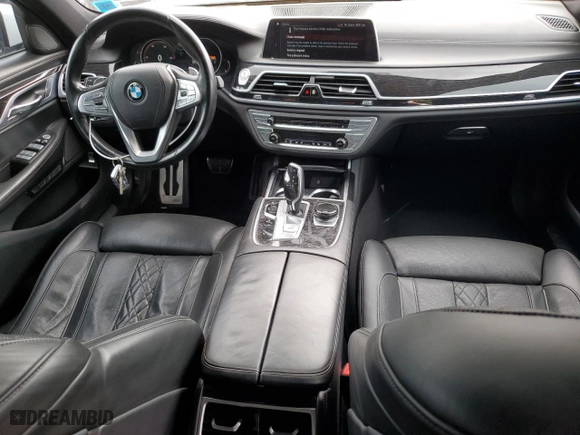 2018 BMW 7 Series 750i xDrive with VIN WBA7F2C56JB238650, listed as a Copart auction lot 64738314 with 96,889 mi miles and Salvage Title. Bid and sale history available at carsss.com. Image 8.