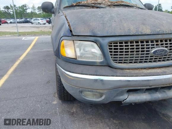 2003 Ford F-150 XLT with VIN 1FTRW076X3KC61967, listed as a IAAI auction lot 42016065 with 206,256 mi miles. Bid and sale history available at carsss.com. Image 12.