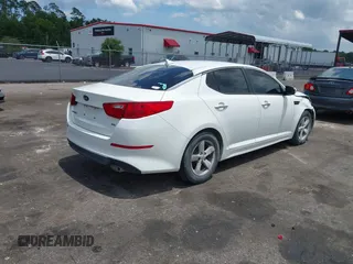 2015 Kia Optima LX with VIN KNAGM4A76F5639319, listed as a IAAI auction lot 42552130 with 207,006 mi miles and . Bid and sale history available at DreamBid. Image 4.