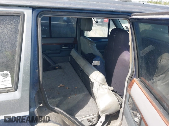 1996 Jeep Cherokee Country with VIN 1J4FT78S5TL148433, listed as a IAAI auction lot 41722054 with 276,612 mi miles and . Bid and sale history available at DreamBid. Image 8.