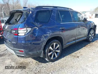 2023 Honda Pilot Touring with VIN 5FNYG2H77PB013559, listed as a IAAI auction lot 41620387 with 59,721 mi miles. Bid and sale history available at carsss.com. Image 4.