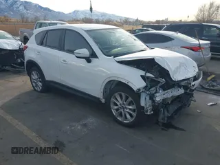 2015 Mazda CX-5 Grand Touring with VIN JM3KE4DY3F0483629, listed as a IAAI auction lot 41054059 with 118,980 mi miles. Bid and sale history available at carsss.com. Image 1.