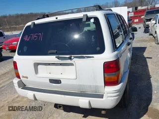 1997 Jeep Grand Cherokee Limited with VIN 1J4GZ78S9VC667698, listed as a IAAI auction lot 41671571 with 191,448 mi miles and . Bid and sale history available at DreamBid. Image 6.