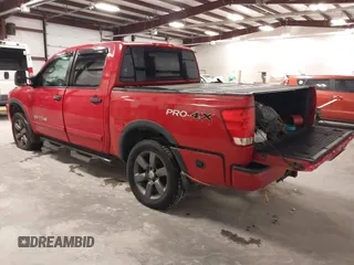 2012 Nissan Titan SV with VIN 1N6AA0EC7CN327973, listed as a IAAI auction lot 41841596 with 148,519 mi miles. Bid and sale history available at carsss.com. Image 3.