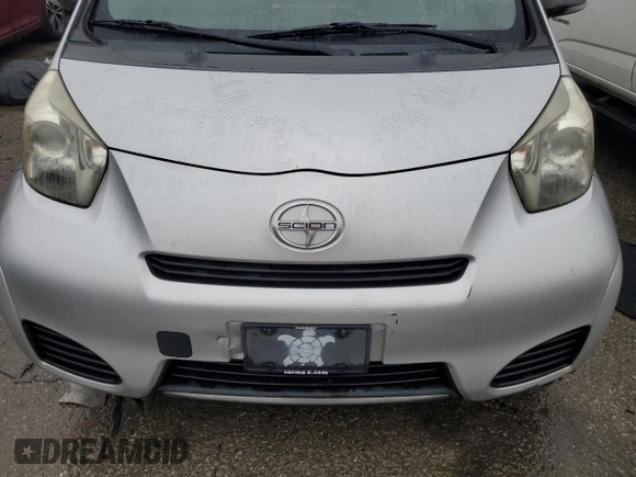 2013 Scion iQ with VIN JTNJJXB08DJ025554, listed as a Copart auction lot 88923885 with 110,378 mi miles and Salvage title. Bid and sale history available at DreamBid. Image 12.