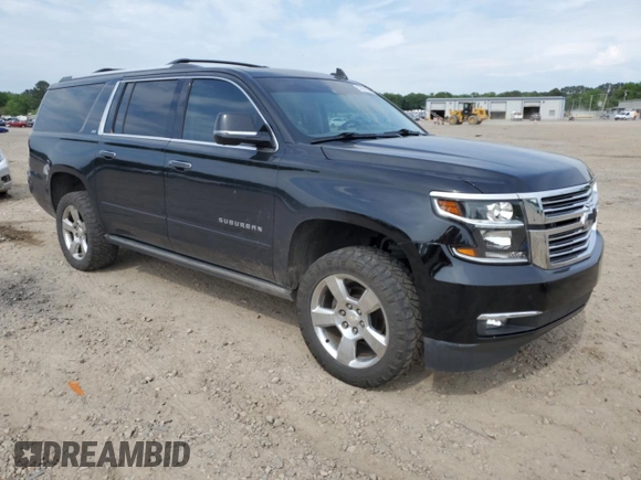 2015 Chevrolet Suburban LTZ with VIN 1GNSKKKC1FR624679, listed as a Copart auction lot 52957365 with 71,194 mi miles and Salvage Title. Bid and sale history available at DreamBid. Image 4.