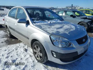 2009 Kia Rio LX with VIN KNADE223196521399, listed as a IAAI auction lot 41591977 with 131,796 mi miles and . Bid and sale history available at DreamBid. Image 1.