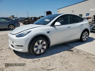 2023 Tesla Model Y Long Range z VIN 7SAYGDEE1PA155629, wystawiony jako Copart lot #52234735 z przebiegiem 24 944 mil mil oraz Szkoda całkowita • Salvage title. Historia ofert i sprzedaży dostępna na DreamBid. Obrazek 1.