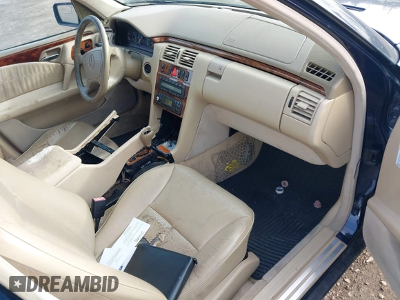 1999 Mercedes-Benz E-Class with VIN WDBJF65H1XA817789, listed as a IAAI auction lot 41818511 with 999,999 mi miles. Bid and sale history available at carsss.com. Image 5.