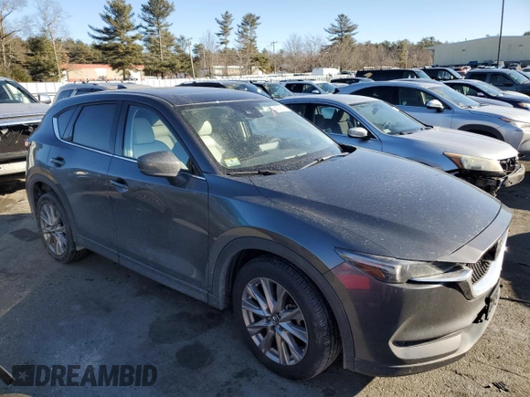 2021 Mazda CX-5 Grand Touring with VIN JM3KFBDM9M0490239, listed as a Copart auction lot 43306975 with 47,010 mi miles and Salvage Title. Bid and sale history available at carsss.com. Image 4.