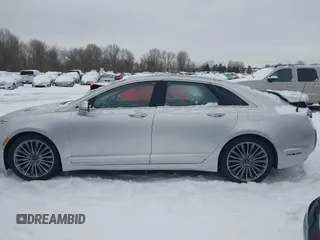 2014 Lincoln MKZ z VIN 3LN6L2JK9ER813109, wystawiony jako IAAI lot #41444866 z przebiegiem 128 613 mil mil oraz . Historia ofert i sprzedaży dostępna na DreamBid. Obrazek 15.