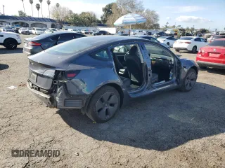 2023 Tesla Model 3 with VIN 5YJ3E1EA3PF541593, listed as a Copart auction lot 43926455 with 26,593 mi miles and Salvage title. Bid and sale history available at DreamBid. Image 3.