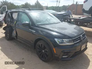 2021 Volkswagen Tiguan SE z VIN 3VV3B7AX5MM027369, wystawiony jako IAAI lot #42082821 z przebiegiem 74 024 mil mil oraz . Historia ofert i sprzedaży dostępna na DreamBid. Obrazek 1.