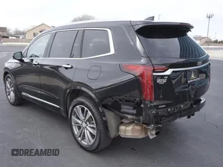 2021 Cadillac XT6 Premium Luxury z VIN 1GYKPDRS3MZ113033, wystawiony jako Copart lot #50076845 z przebiegiem 104 248 mil mil oraz Szkody całkowita. Historia ofert i sprzedaży dostępna na DreamBid. Obrazek 4.