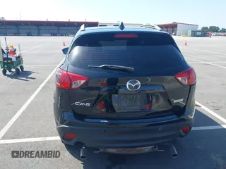 2014 Mazda CX-5 Sport z VIN JM3KE2BE8E0371775, wystawiony jako IAAI lot #42111417 z przebiegiem 150 932 mil mil oraz . Historia ofert i sprzedaży dostępna na DreamBid. Obrazek 16.