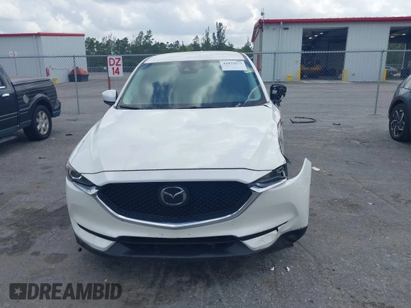 2018 Mazda CX-5 Touring z VIN JM3KFACM6J1419663, wystawiony jako IAAI lot #41879677 z przebiegiem 115 224 mil mil oraz . Historia ofert i sprzedaży dostępna na DreamBid. Obrazek 12.