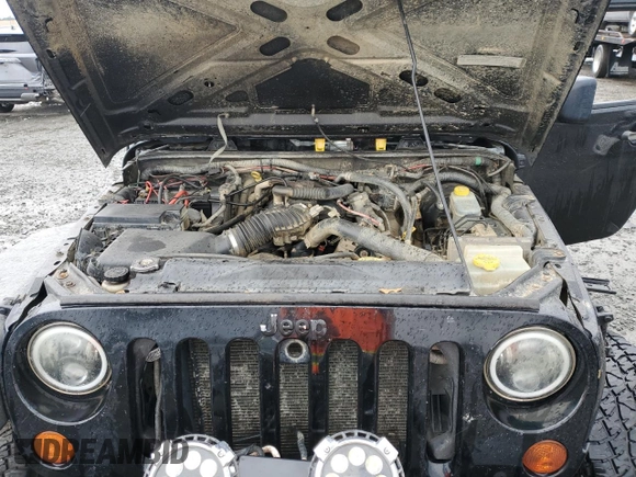2009 Jeep Wrangler X with VIN 1J4FA241X9L735743, listed as a Copart auction lot 48109455 with 232,110 mi miles and Salvage Title. Bid and sale history available at DreamBid. Image 11.