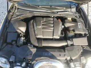 2000 Jaguar S-Type V8 z VIN SAJDA01D4YGL61655, wystawiony jako Copart lot #85873054 z przebiegiem 85 239 mil mil oraz Nie do naprawy • Non repairable. Historia ofert i sprzedaży dostępna na DreamBid. Obrazek 11.