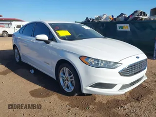 2018 Ford Fusion Hybrid S with VIN 3FA6P0UU0JR204324, listed as a IAAI auction lot 41312303 with 100,527 mi miles. Bid and sale history available at carsss.com. Image 1.