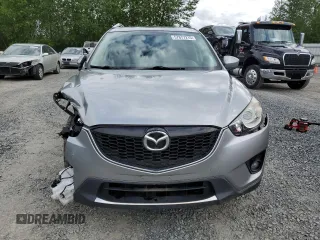 2014 Mazda CX-5 Touring z VIN JM3KE4CY0E0407169, wystawiony jako Copart lot #57877215 z przebiegiem 168 277 mil mil oraz Szkoda całkowita • Salvage title. Historia ofert i sprzedaży dostępna na DreamBid. Obrazek 5.