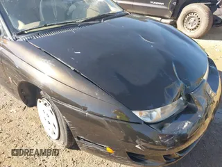 1997 Saturn SC z VIN 1G8ZE1283VZ163658, wystawiony jako IAAI lot #40494467 z przebiegiem 111 701 mil mil oraz . Historia ofert i sprzedaży dostępna na DreamBid. Obrazek 6.