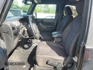 2014 Jeep Wrangler Sport z VIN 1C4AJWAG0EL147523, wystawiony jako Copart lot #59682015 z przebiegiem 196 258 mil mil oraz Szkoda całkowita • Salvage title. Historia ofert i sprzedaży dostępna na DreamBid. Obrazek 7.