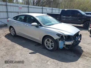 2018 Ford Fusion SE z VIN 3FA6P0H77JR226390, wystawiony jako IAAI lot #42120981 z przebiegiem 114 057 mil mil oraz . Historia ofert i sprzedaży dostępna na DreamBid. Obrazek 1.