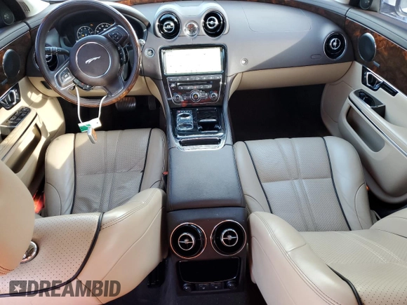 2018 Jaguar XJ with VIN SAJWA1C77J8W14750, listed as a Copart auction lot 87273204 with 51,040 mi miles and Clean Title. Bid and sale history available at carsss.com. Image 8.