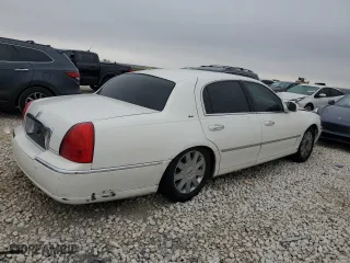 2003 Lincoln Town Car Cartier with VIN 1LNHM83W23Y627418, listed as a Copart auction lot 43817895 with 141,414 mi miles and Salvage Title. Bid and sale history available at carsss.com. Image 3.