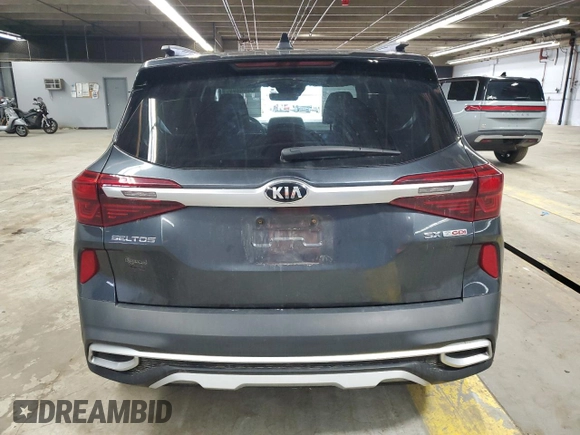 2021 Kia Seltos SX with VIN KNDETCA2XM7167199, listed as a Copart auction lot 52080495 with 82,981 mi miles and Salvage Title. Bid and sale history available at carsss.com. Image 6.
