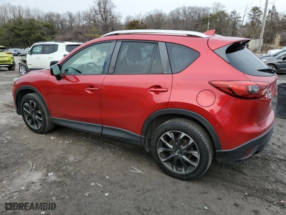2016 Mazda CX-5 Grand Touring with VIN JM3KE4DY5G0730053, listed as a Copart auction lot 43776155 with 157,399 mi miles and Salvage Title. Bid and sale history available at carsss.com. Image 2.