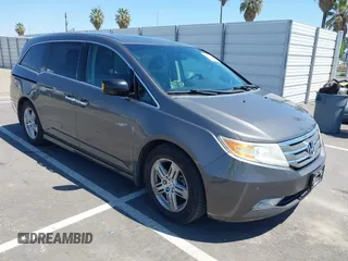 2012 Honda Odyssey Touring с VIN 5FNRL5H98CB011297, выставлен на аукционе IAAI как лот 42207061 с пробегом 154 073 миль миль и . История ставок и продаж доступна на DreamBid. Изображение 1.
