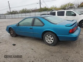 1994 Ford Thunderbird LX with VIN 1FALP6243RH223519, listed as a Copart auction lot 80962814 with 125,016 mi miles and Salvage Title. Bid and sale history available at DreamBid. Image 2.