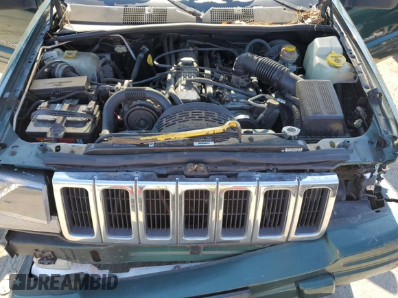 1998 Jeep Grand Cherokee with VIN 1J4FX48S8WC281615, listed as a Copart auction lot 77305594 with 128,393 mi miles and Salvage title. Bid and sale history available at DreamBid. Image 12.