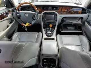 2006 Jaguar XJ with VIN SAJWA71B06SH03941, listed as a Copart auction lot 76013984 with 0 mi miles and Salvage Title. Bid and sale history available at carsss.com. Image 8.