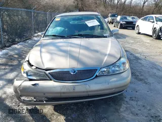 1999 Mercury Mystique GS z VIN 1MEFM6530XK635463, wystawiony jako IAAI lot #41478903 z przebiegiem 87 911 mil mil oraz . Historia ofert i sprzedaży dostępna na DreamBid. Obrazek 12.