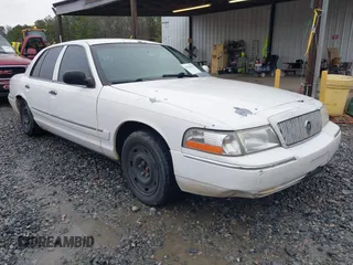 2004 Mercury Grand Marquis GS z VIN 2MEFM74W64X631296, wystawiony jako IAAI lot #41584550 z przebiegiem 222 466 mil mil oraz . Historia ofert i sprzedaży dostępna na DreamBid. Obrazek 1.