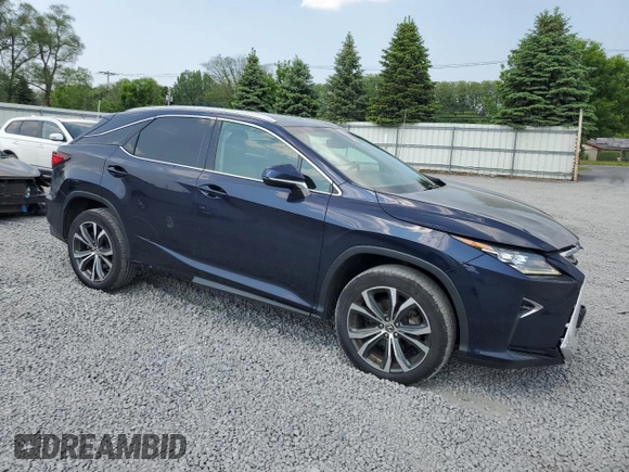 2018 Lexus RX 350 with VIN 2T2BZMCA6JC149235, listed as a Copart auction lot 59939505 with 214,676 mi miles and Salvage title. Bid and sale history available at DreamBid. Image 4.