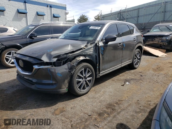 2018 Mazda CX-5 Grand Touring z VIN JM3KFBDM4J0300519, wystawiony jako Copart lot #51548745 z przebiegiem 102 853 mil mil oraz Szkoda całkowita • Salvage title. Historia ofert i sprzedaży dostępna na DreamBid. Obrazek 1.
